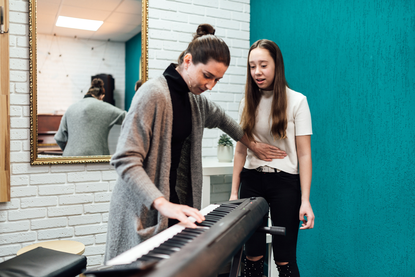 Woman Teaching Student to Sing